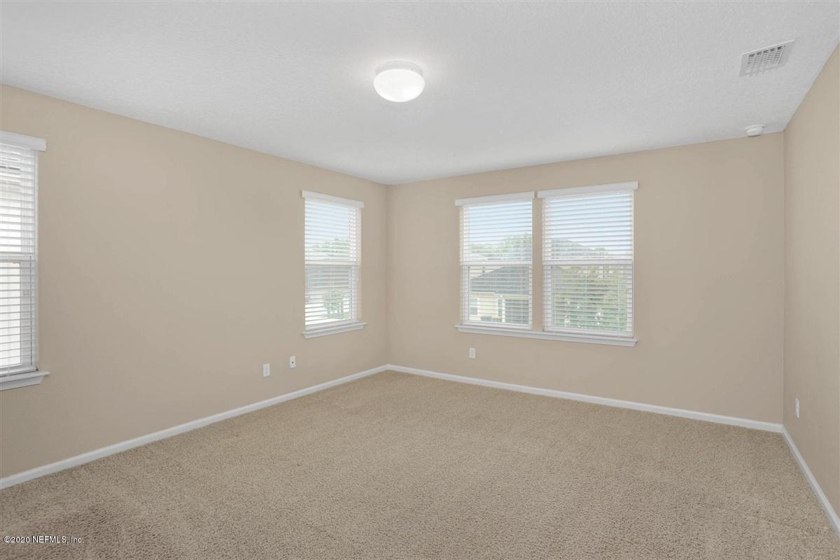 6775 Azalea Park Road Jacksonville, FL 32259 - Photo 12 of 22 an empty room with windows