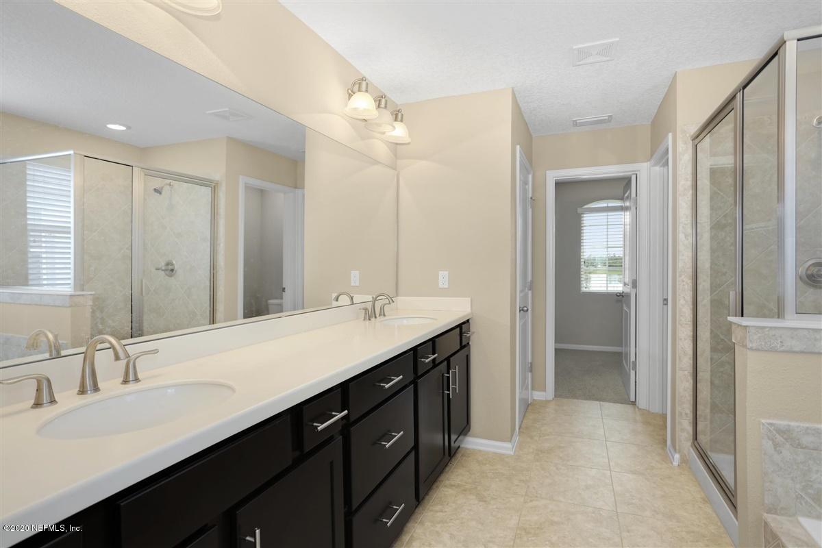 6775 Azalea Park Road Jacksonville, FL 32259 - Photo 13 of 22 a bathroom with a double vanity sink mirror and double