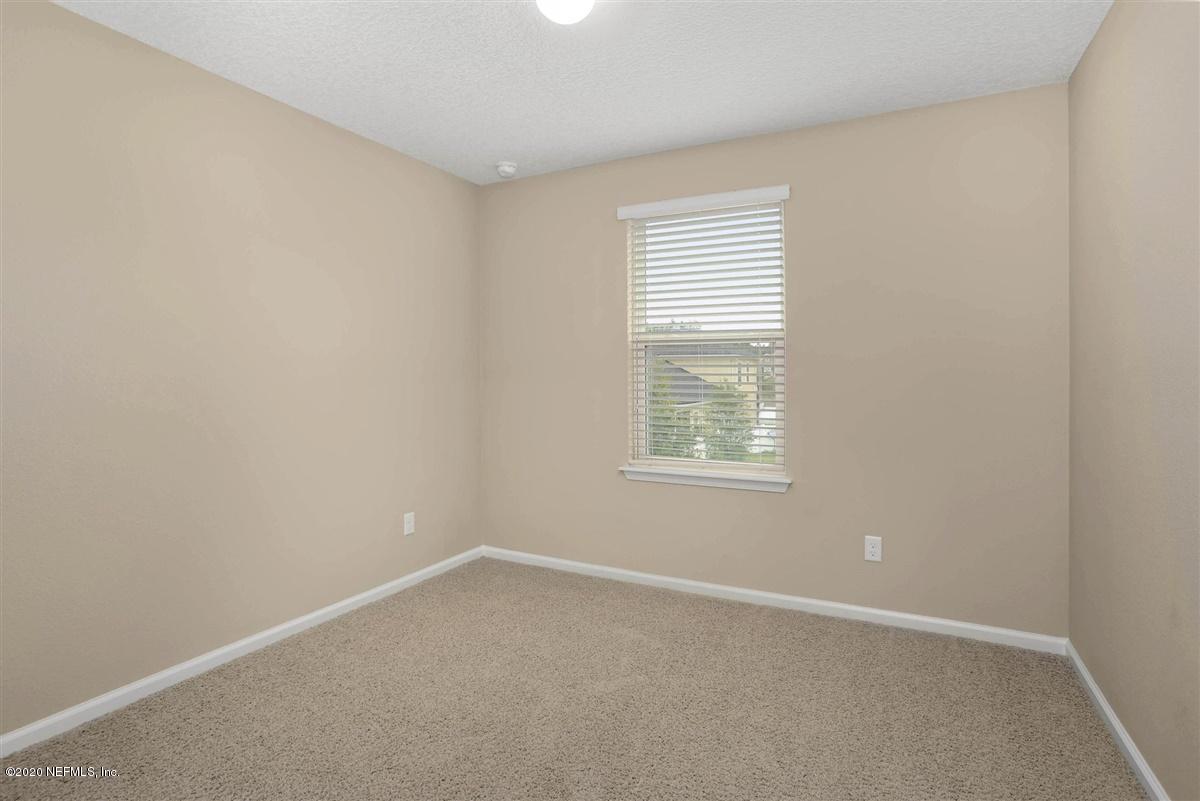 6775 Azalea Park Road Jacksonville, FL 32259 - Photo 15 of 22 an empty room with a window