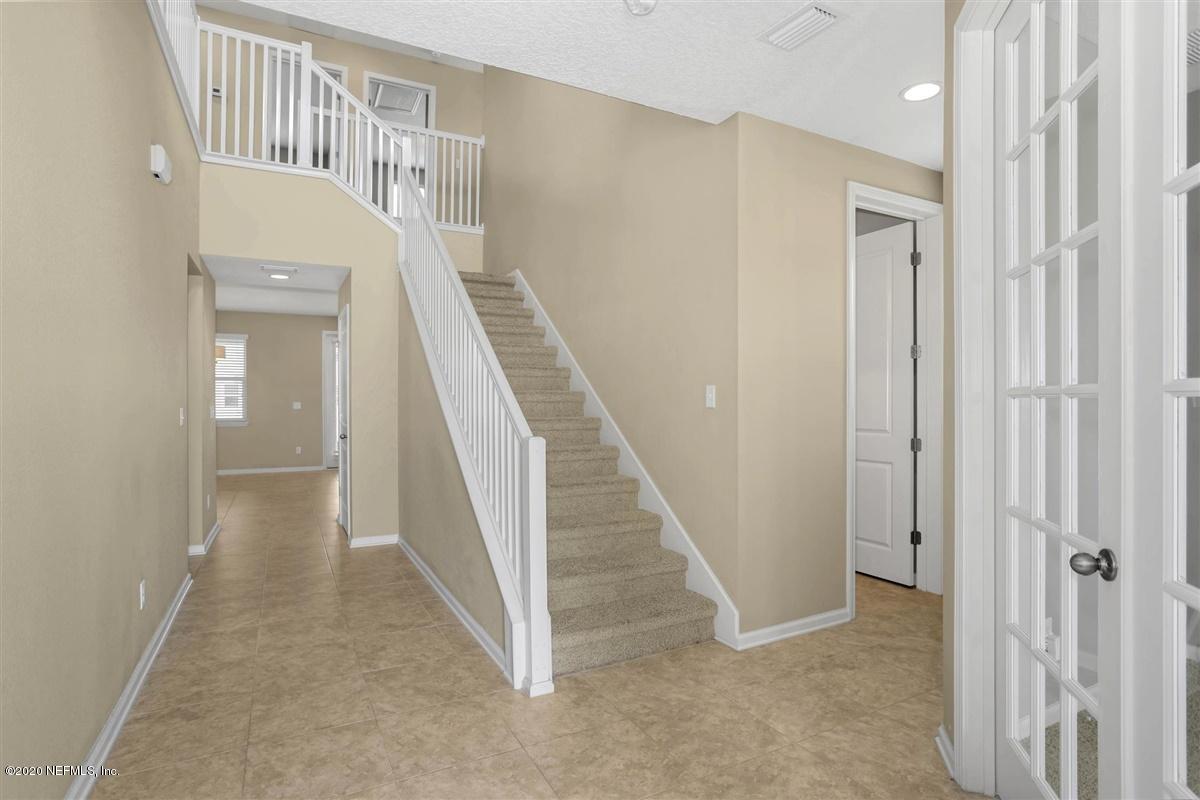 6775 Azalea Park Road Jacksonville, FL 32259 - Photo 2 of 22 a view of a hallway with staircase