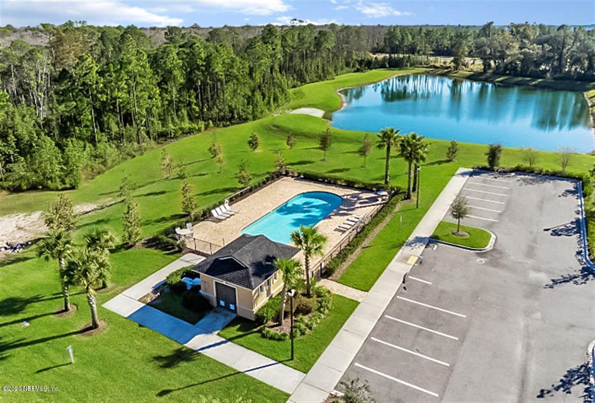 6775 Azalea Park Road Jacksonville, FL 32259 - Photo 21 of 22 an aerial view of a house with a lake view