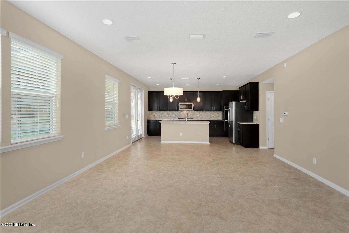 6775 Azalea Park Road Jacksonville, FL 32259 - Photo 5 of 22 a view of a kitchen with a sink and a refrigerator