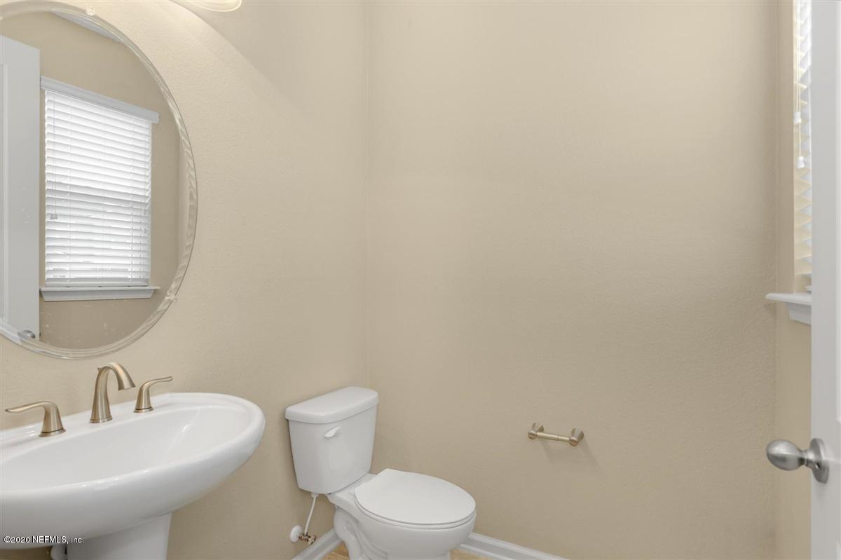 6775 Azalea Park Road Jacksonville, FL 32259 - Photo 9 of 22 a bathroom with a toilet a sink and mirror