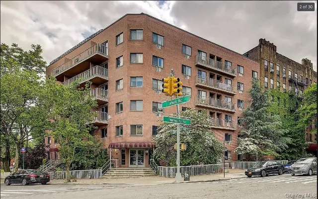 a variety of fruits and vegetables with building in the background