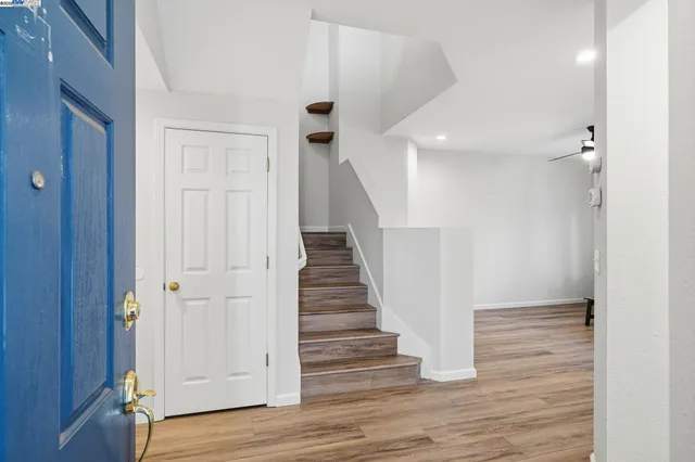 a view of entryway with wooden floor