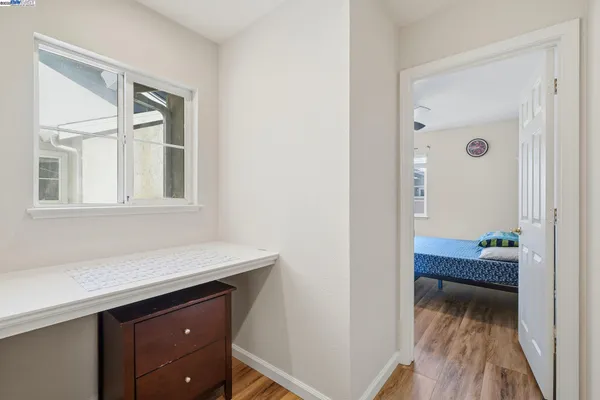 a room that has a dresser and a window in it