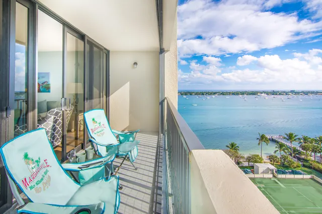 a view of a balcony with chairs