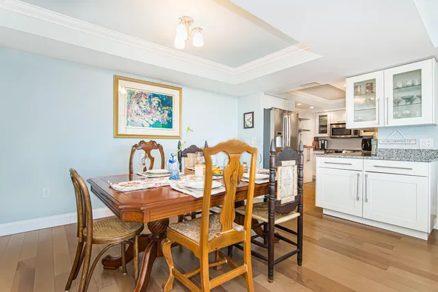 a view of a dining room with furniture and wooden floor
