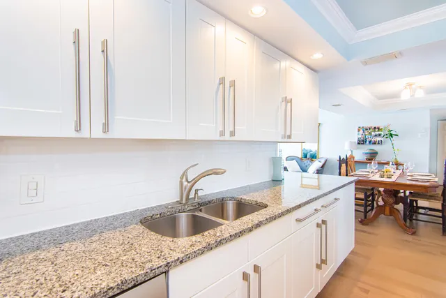 a kitchen with a sink cabinets and window