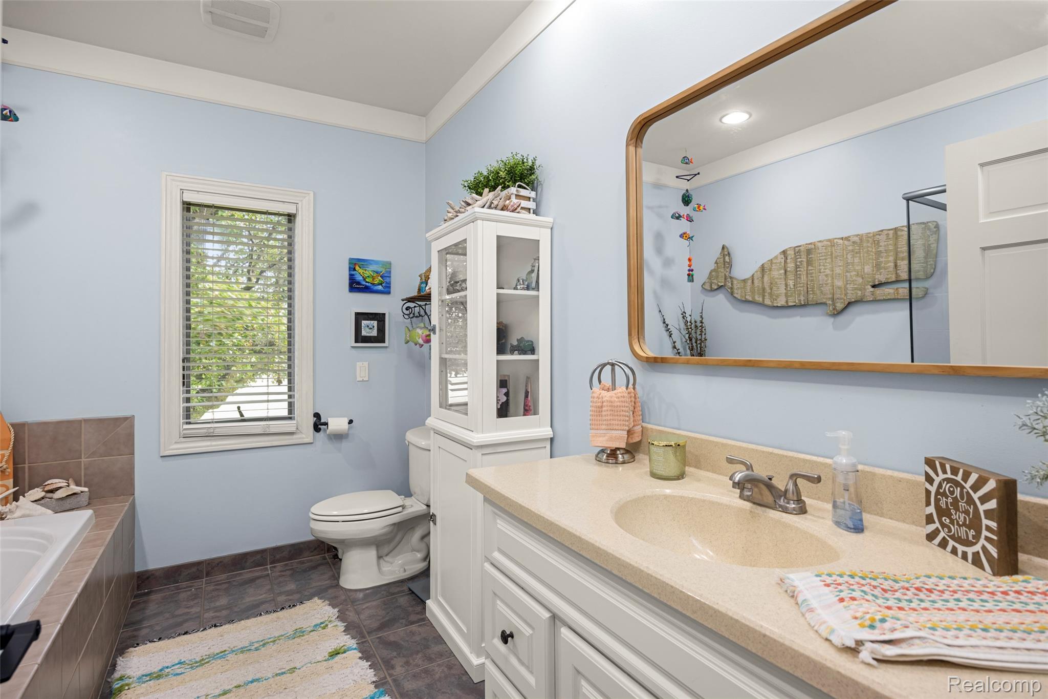 7030 Marsh Road Marine City, MI 48039 - Photo 24 of 47 Full bath featuring vanity, a garden tub, and crown molding