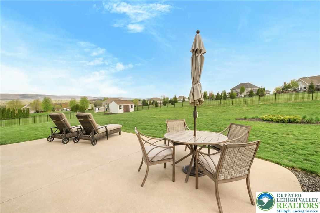 208 East Dell Road Bath, PA 18014 - Photo 32 of 40 a view of a table and chairs in the garden