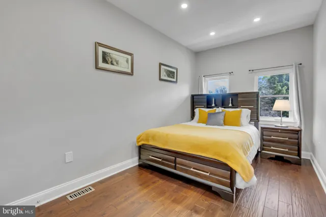 a bed room with a bed and a night stand