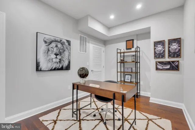 a workspace with furniture and rug