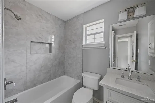 a bathroom with a sink toilet and bathtub