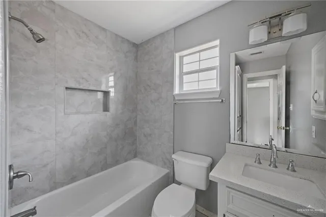 a bathroom with a sink toilet and bathtub