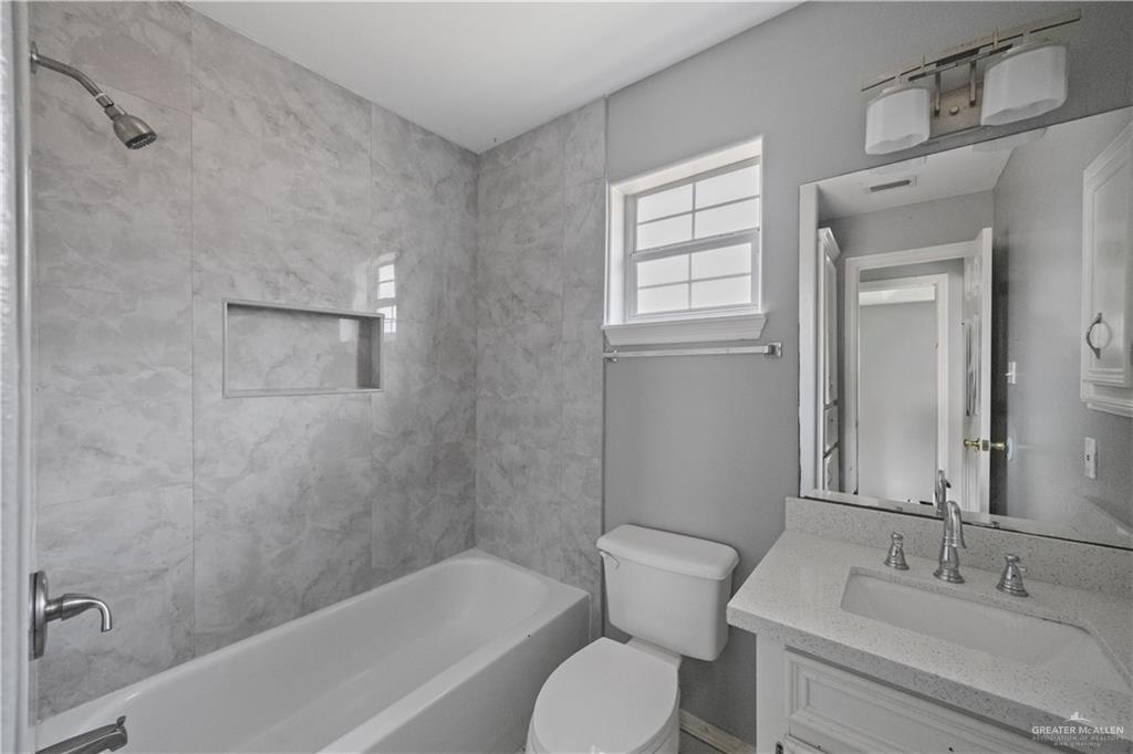 2205 North Erica Street Pharr, TX 78577 - Photo 11 of 21 a bathroom with a sink toilet and bathtub
