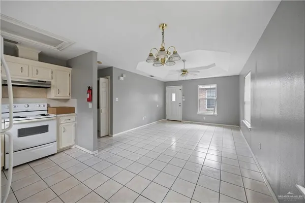 a view of a kitchen with cabinets and stainless steel appliances