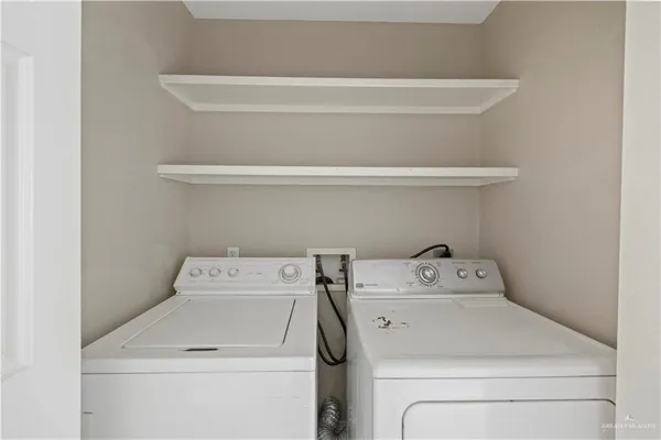a utility room with dryer and washer