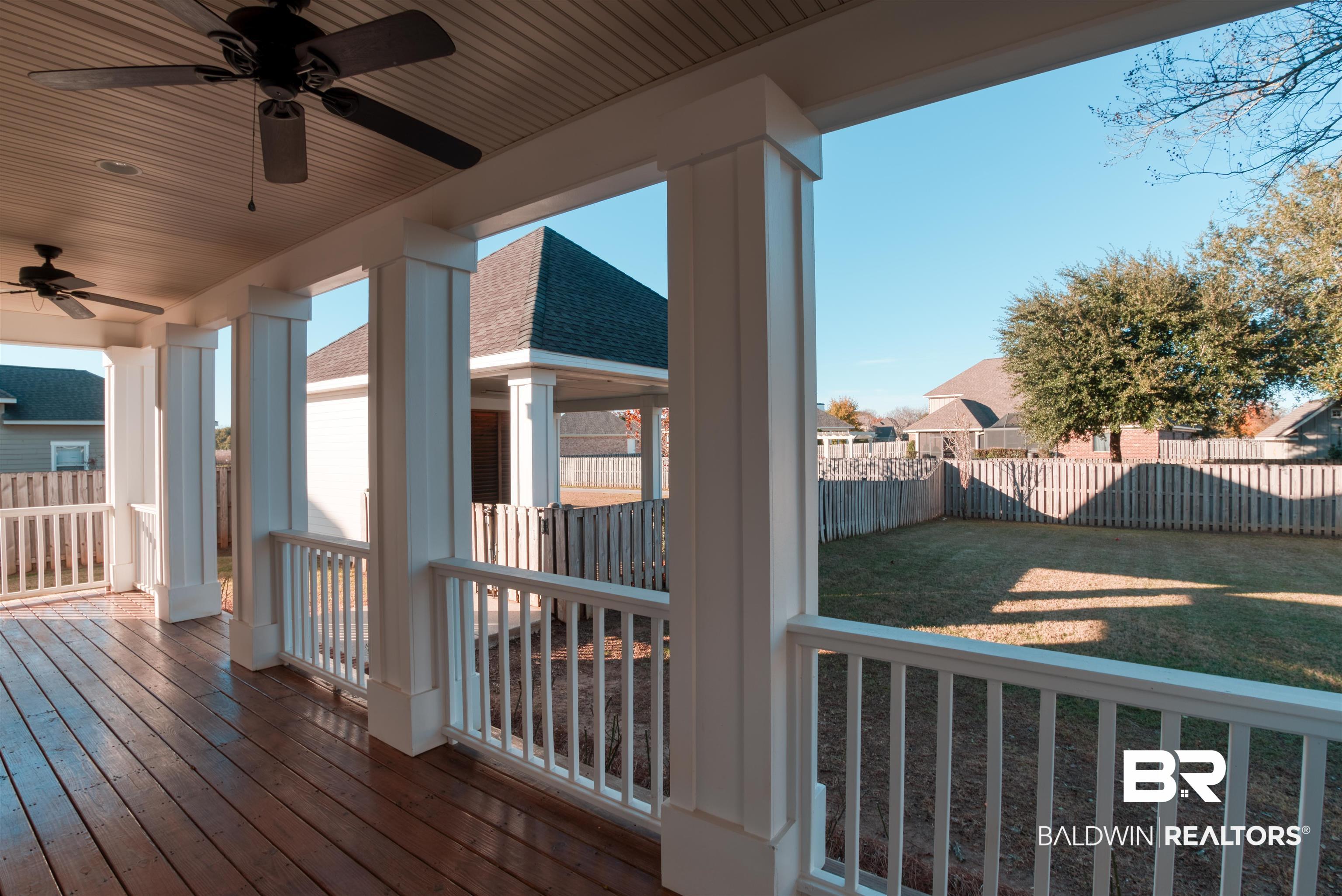 24561 Austin Road Daphne, AL 36526 - Photo 41 of 57 Wooden deck featuring a yard and ceiling fan