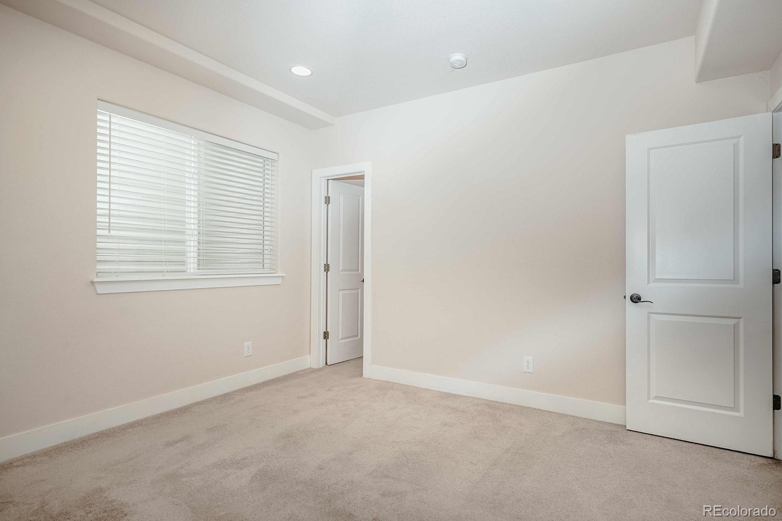 10608 Rutledge Street Parker, CO 80134 - Photo 23 of 24 an empty room with windows and closet