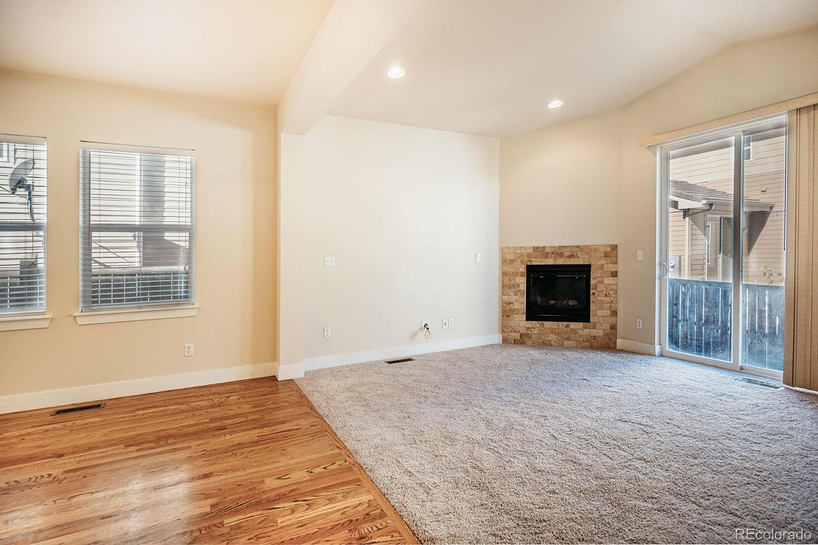 10608 Rutledge Street Parker, CO 80134 - Photo 5 of 24 a view of empty room with wooden floor and a window
