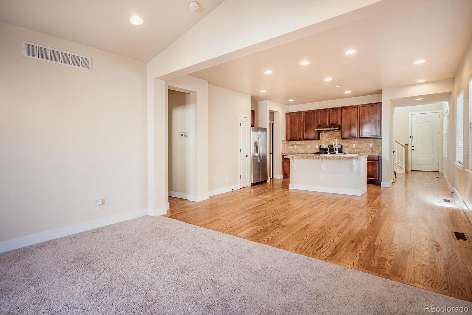 10608 Rutledge Street Parker, CO 80134 - Photo 7 of 24 a view of kitchen with wooden floor