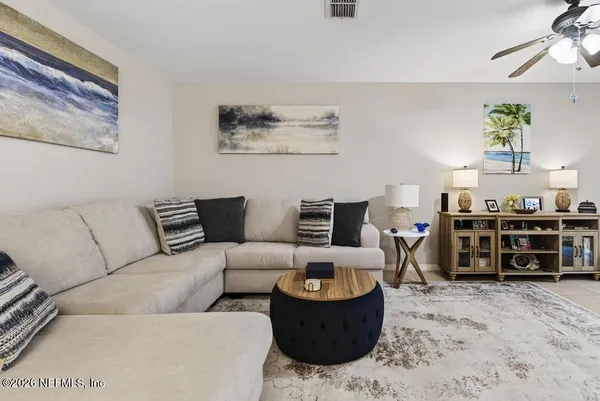 a bedroom with a bed and a lamp on table