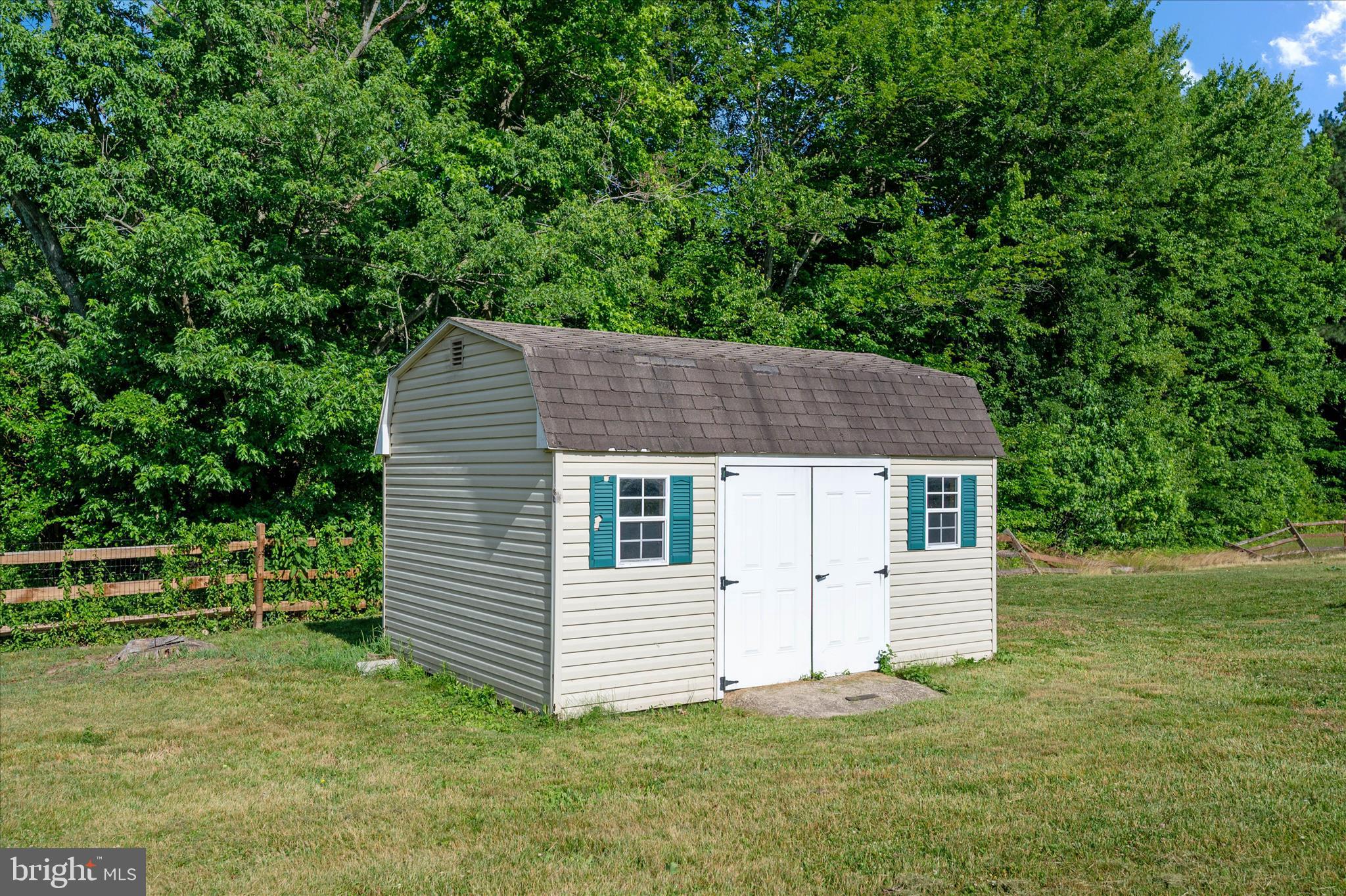 913 Clark Corner Road Centreville, MD 21617 - Photo 40 of 66 a view of a house with a yard