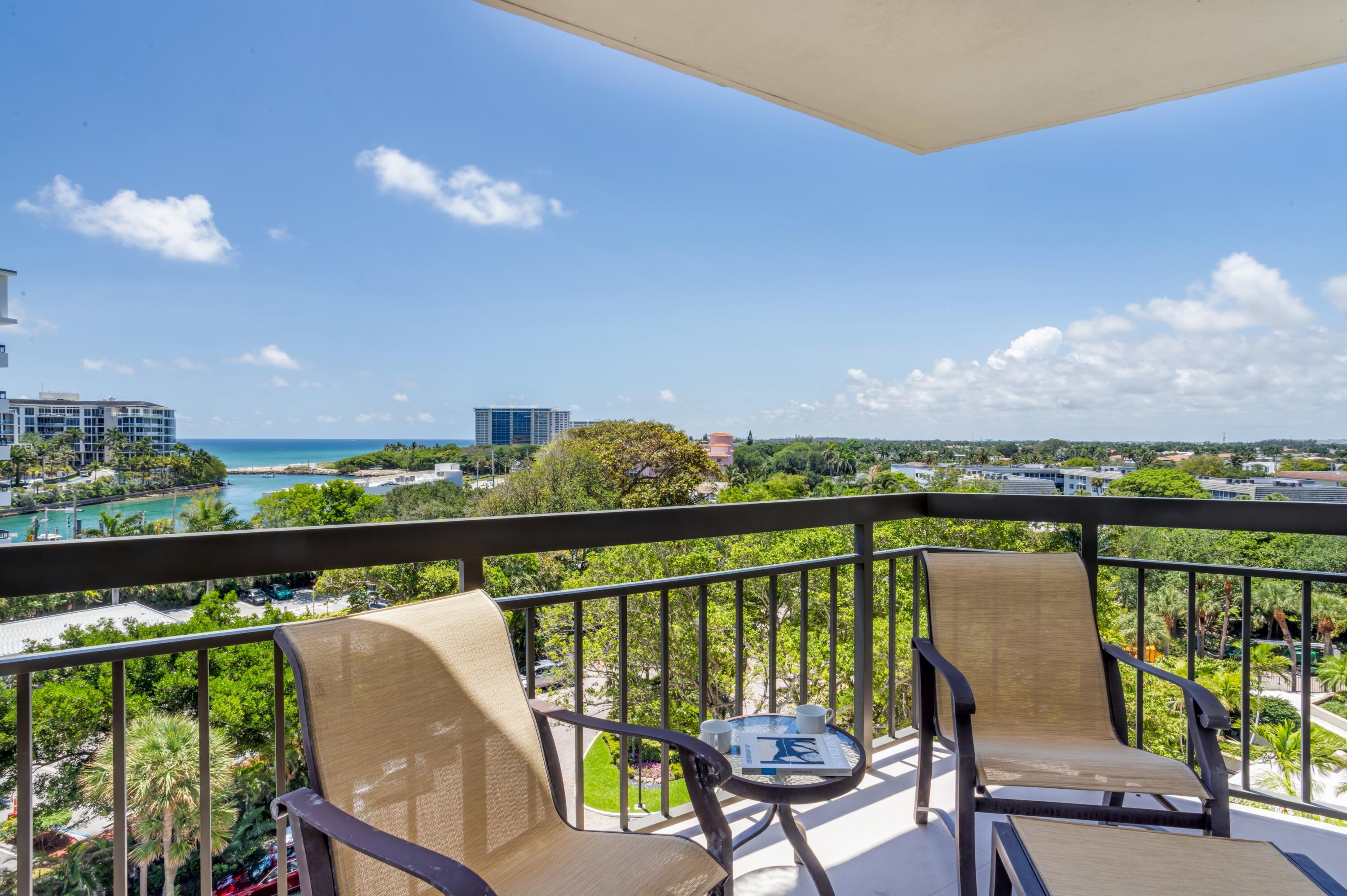 901 East Camino Real, Unit 7C Boca Raton, FL 33432 - Photo 12 of 41 a view of a balcony with wooden floor and outdoor seating