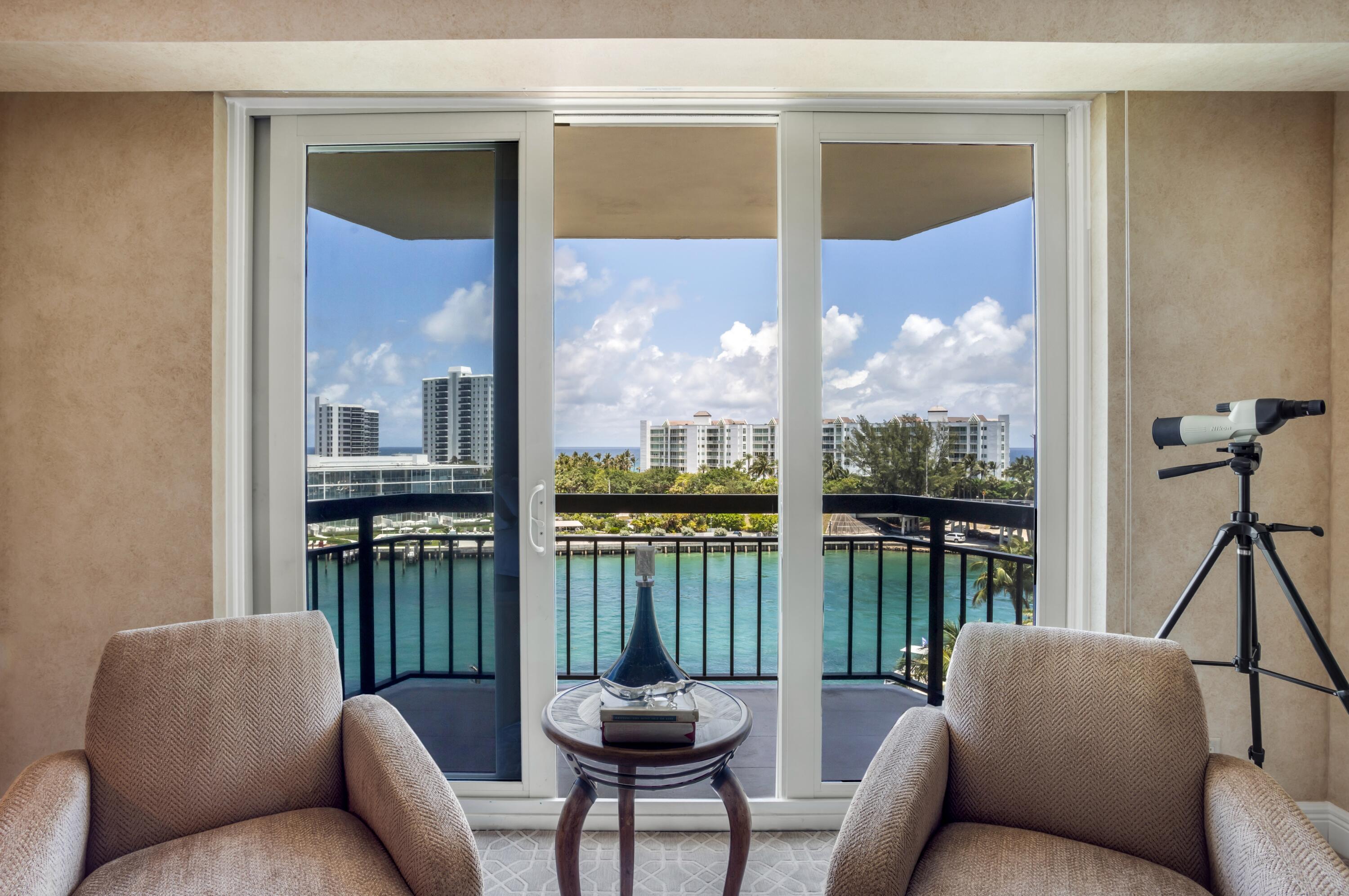 901 East Camino Real, Unit 7C Boca Raton, FL 33432 - Photo 24 of 41 a living room with furniture and a floor to ceiling window