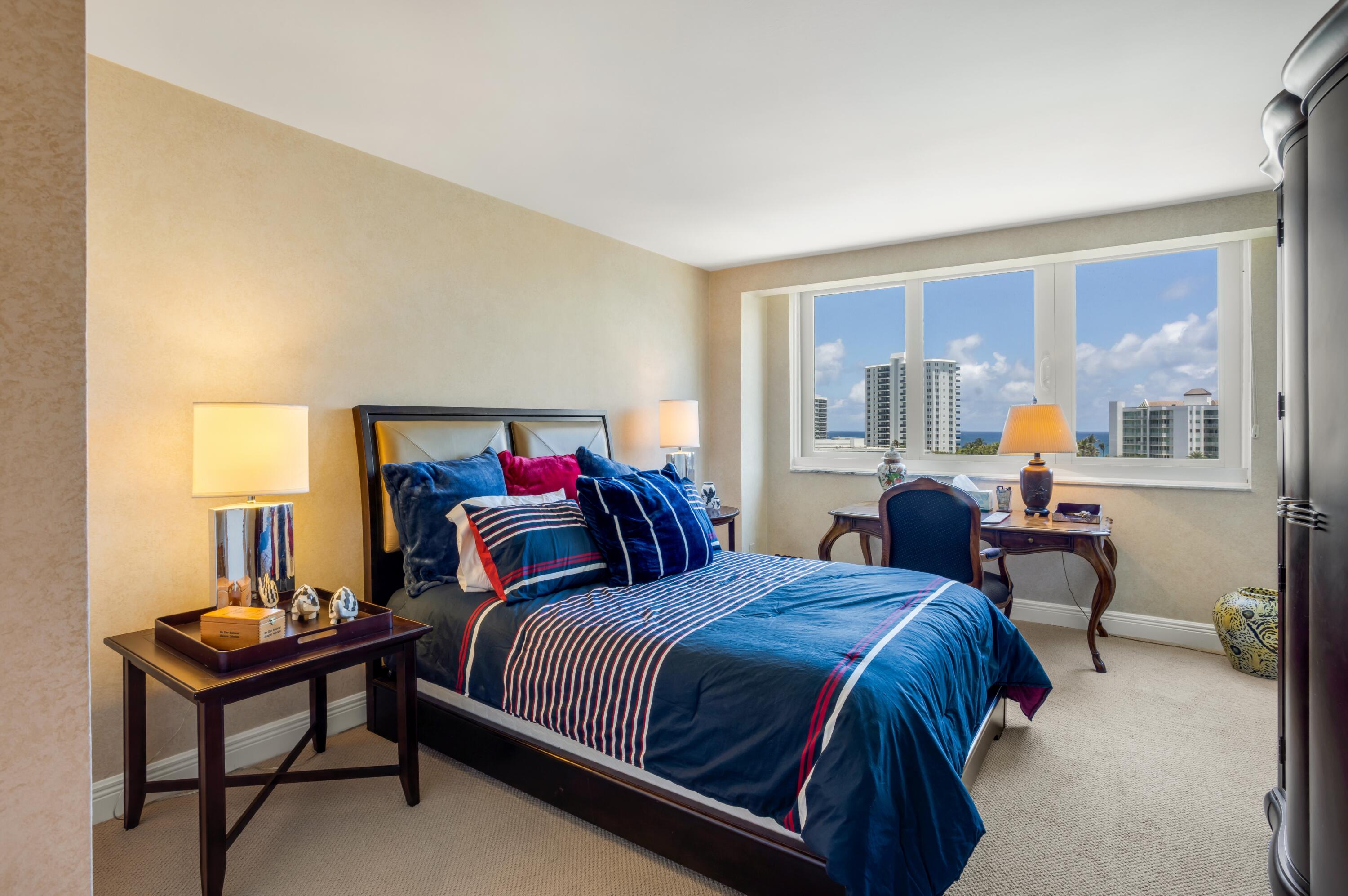 901 East Camino Real, Unit 7C Boca Raton, FL 33432 - Photo 28 of 41 a bedroom with double bed and a window