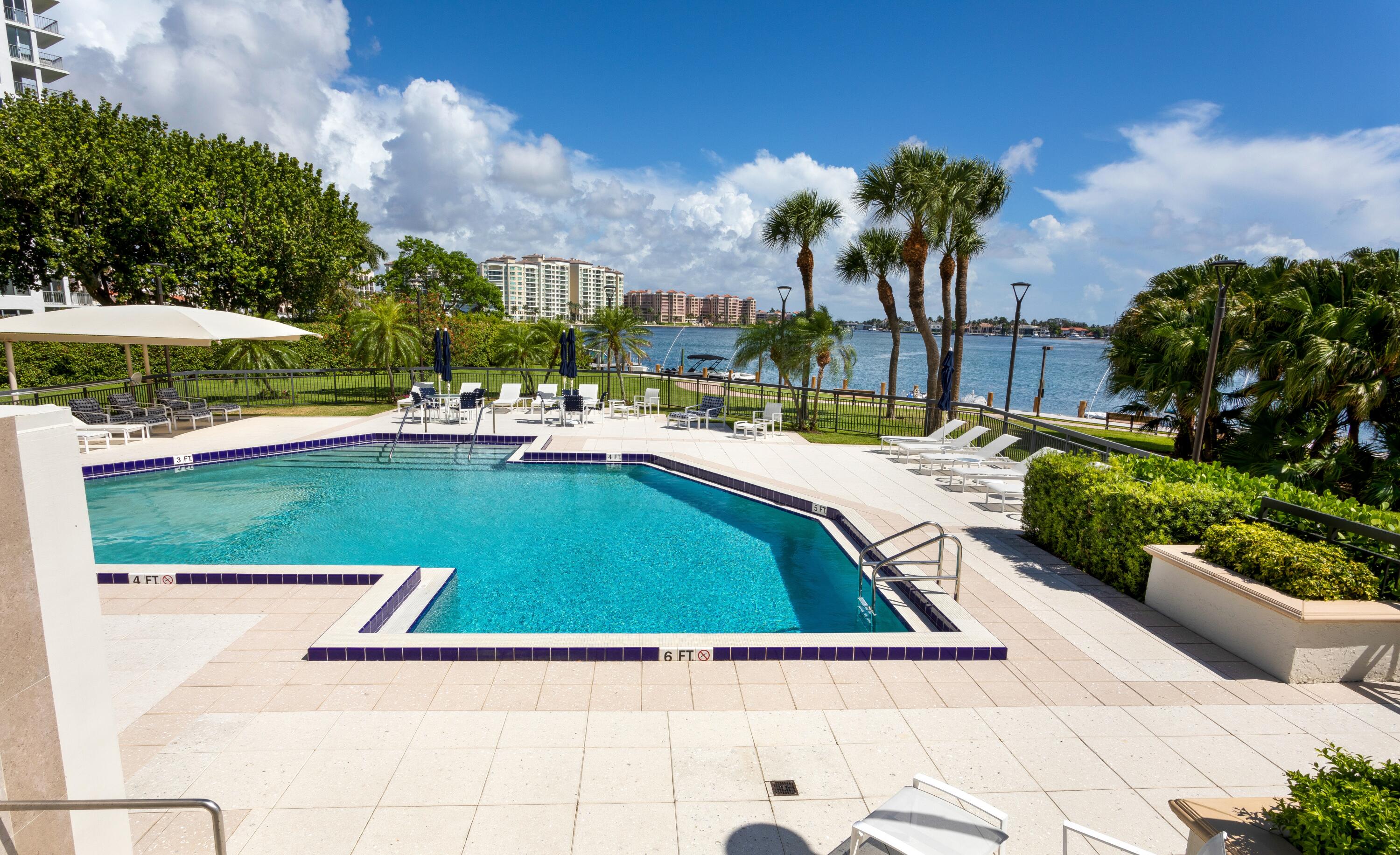 901 East Camino Real, Unit 7C Boca Raton, FL 33432 - Photo 39 of 41 a view of swimming pool with outdoor seating and green space