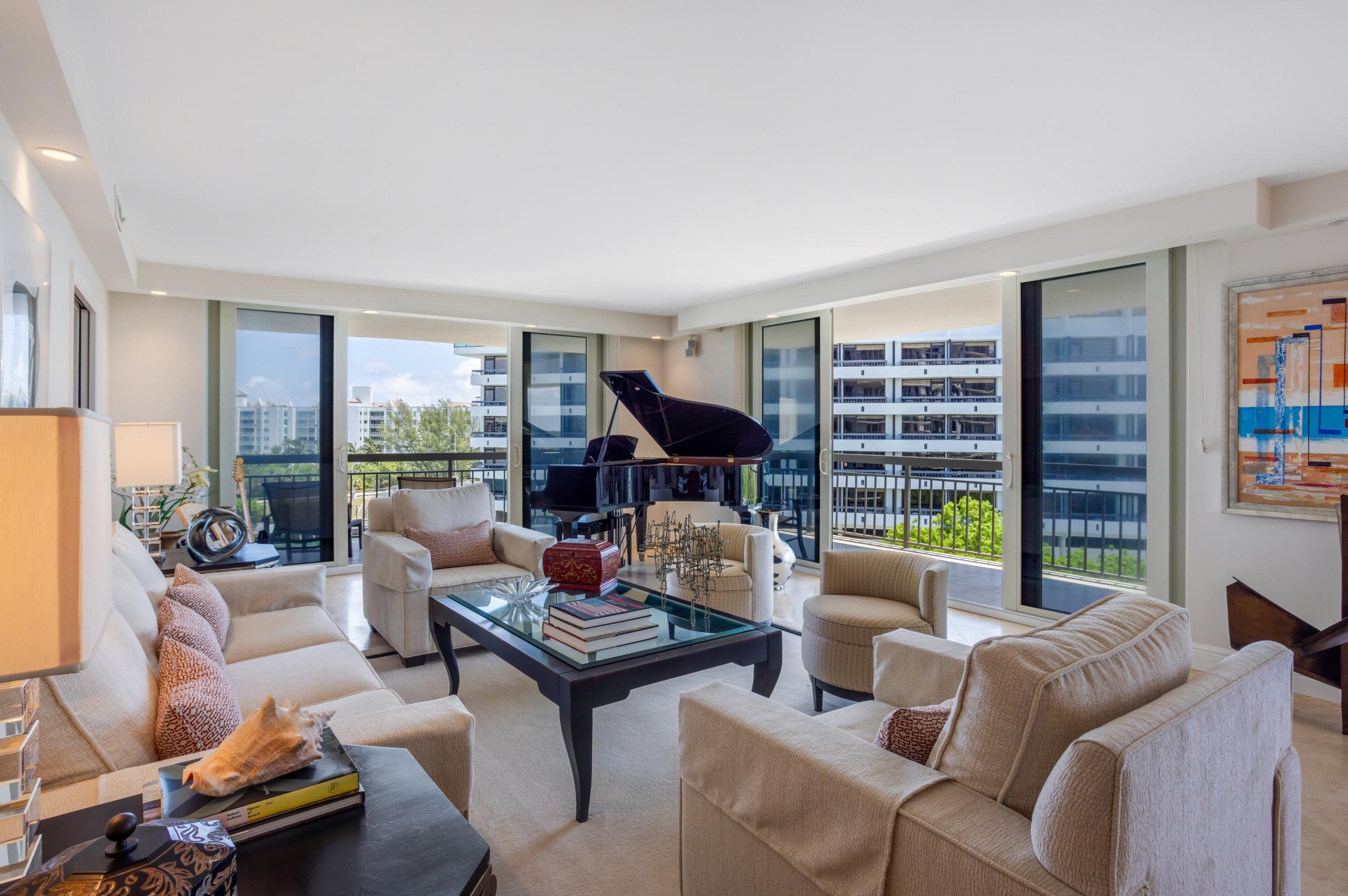 901 East Camino Real, Unit 7C Boca Raton, FL 33432 - Photo 8 of 41 a living room with furniture a rug and a large window