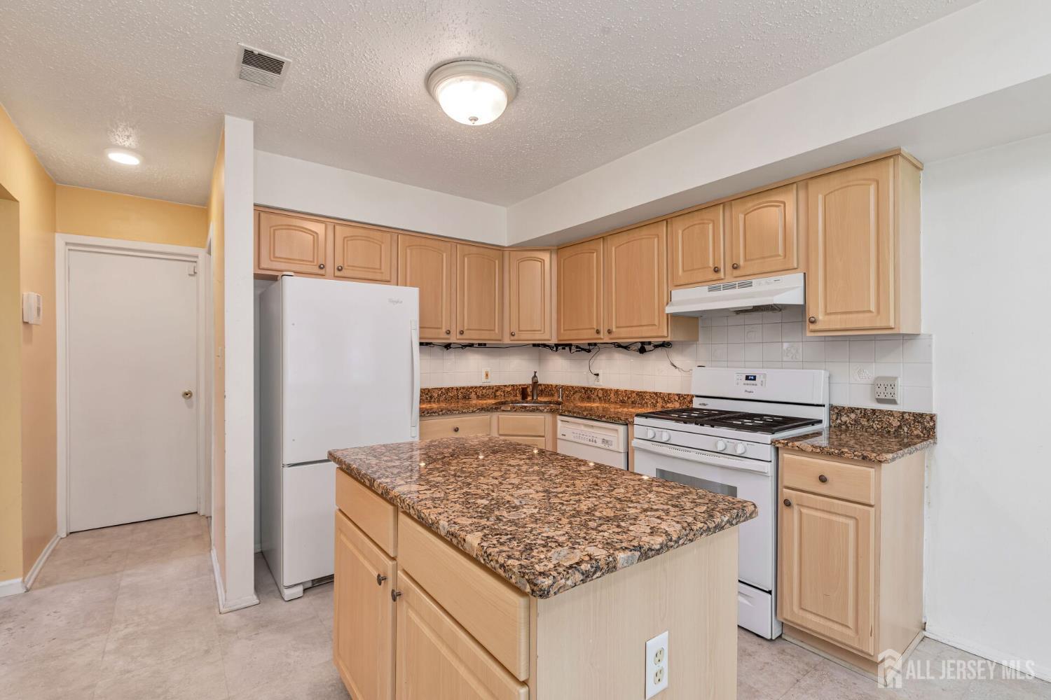 146 Nebula Road Piscataway, NJ 08854 - Photo 11 of 51 a kitchen with a stove a refrigerator and a sink