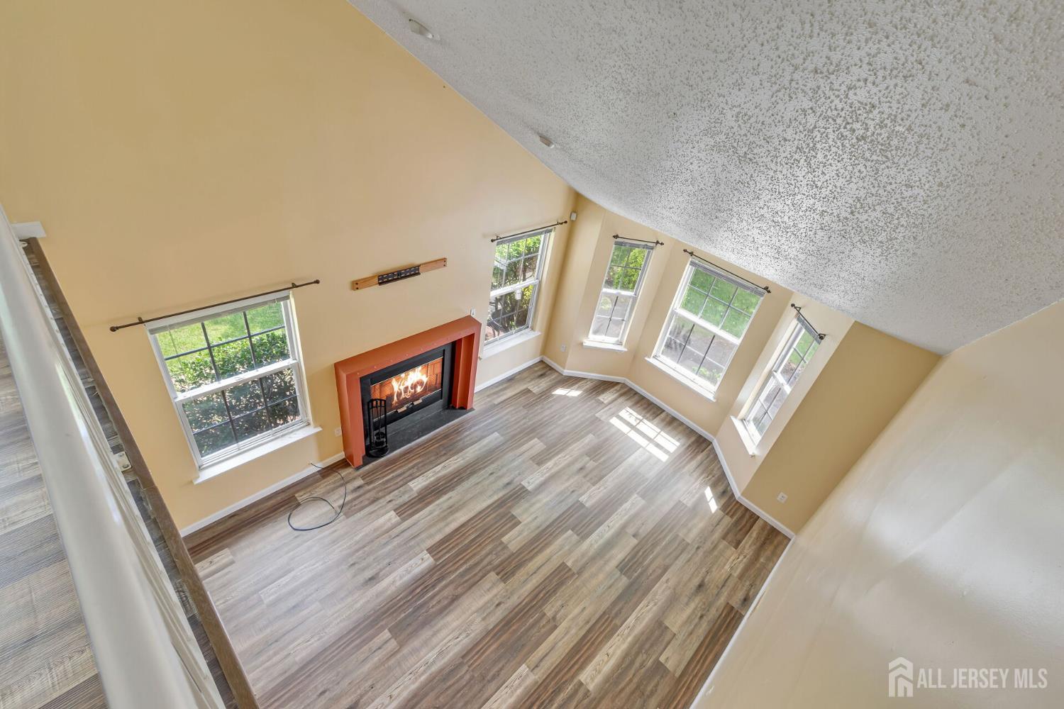 146 Nebula Road Piscataway, NJ 08854 - Photo 21 of 51 a view of an empty room with wooden floor and a window