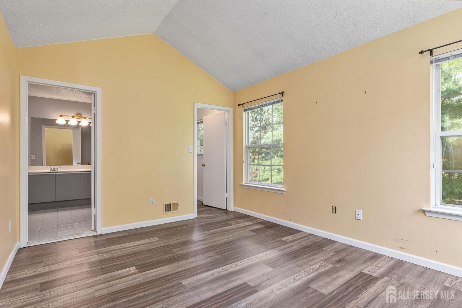 146 Nebula Road Piscataway, NJ 08854 - Photo 24 of 51 a view of an empty room with wooden floor and a window