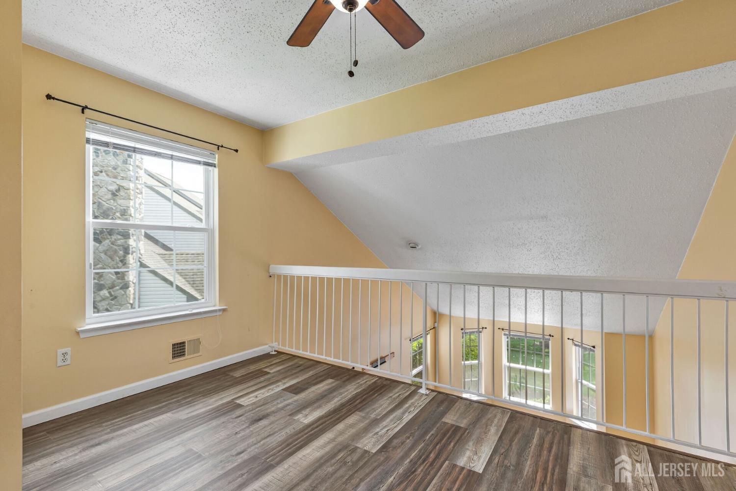 146 Nebula Road Piscataway, NJ 08854 - Photo 30 of 51 a view of an empty room with wooden floor and a window