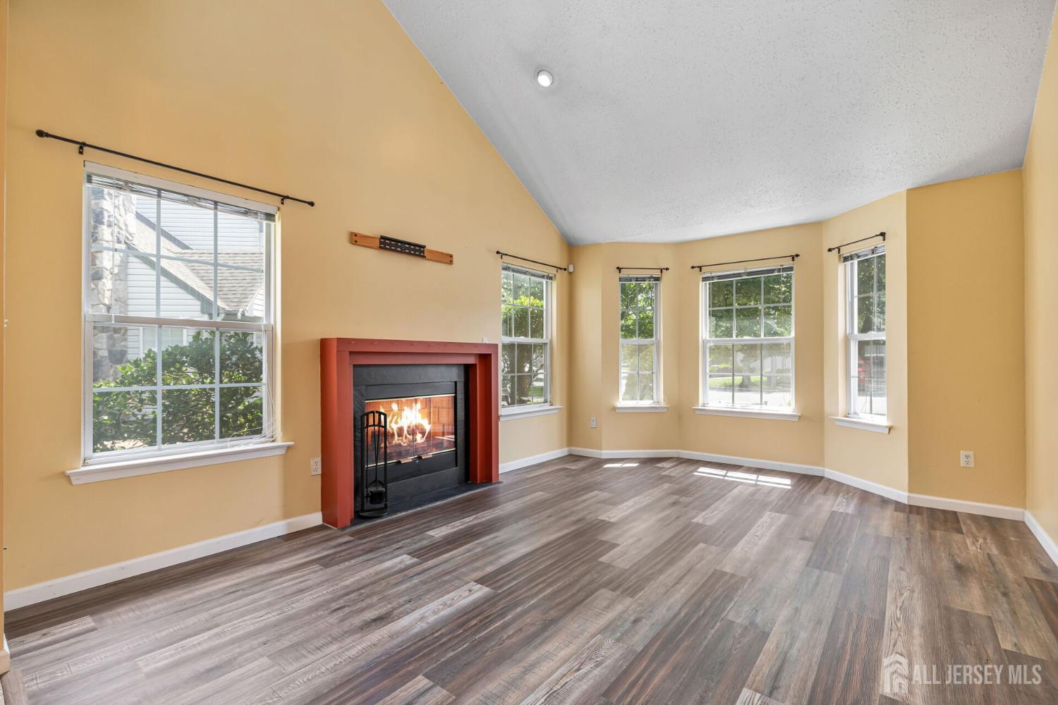 146 Nebula Road Piscataway, NJ 08854 - Photo 5 of 51 a view of an empty room with a window and wooden floor