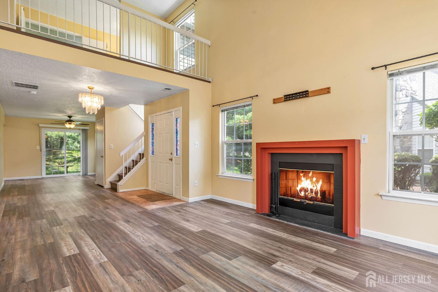 146 Nebula Road Piscataway, NJ 08854 - Photo 7 of 51 a view of an empty room with wooden floor fireplace and a window