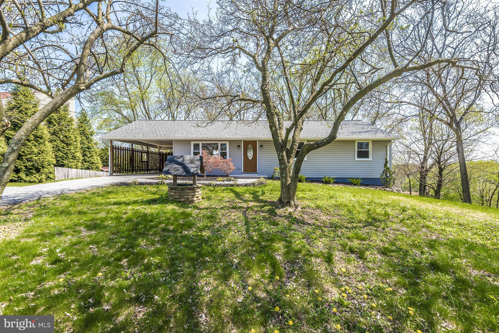 14723 Harrisville Road Mount Airy, MD 21771 - Photo 1 of 29 a front view of a house with garden