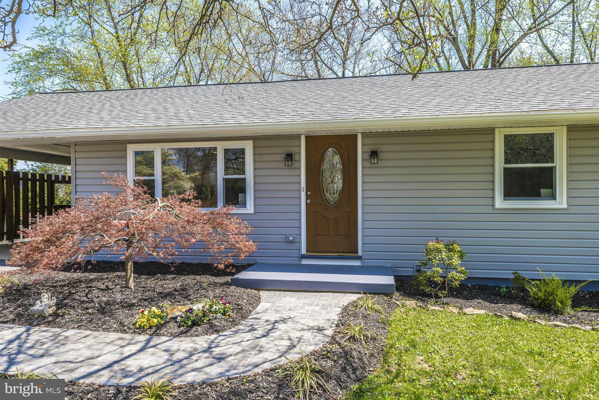 14723 Harrisville Road Mount Airy, MD 21771 - Photo 2 of 29 a front view of a house with a garden