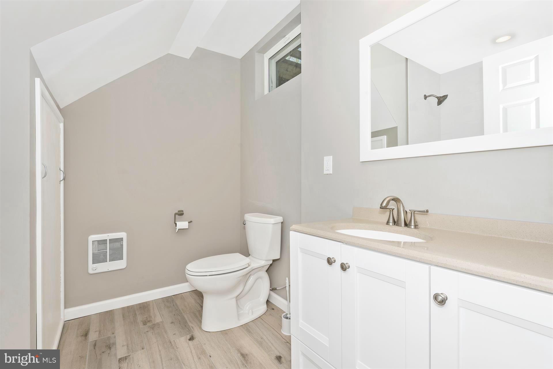 14723 Harrisville Road Mount Airy, MD 21771 - Photo 23 of 29 a bathroom with a granite countertop sink toilet and a mirror