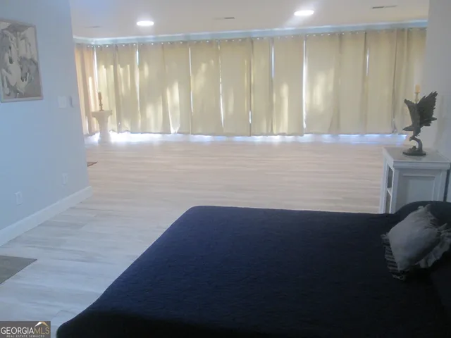 a view of wooden floor and chair in a room