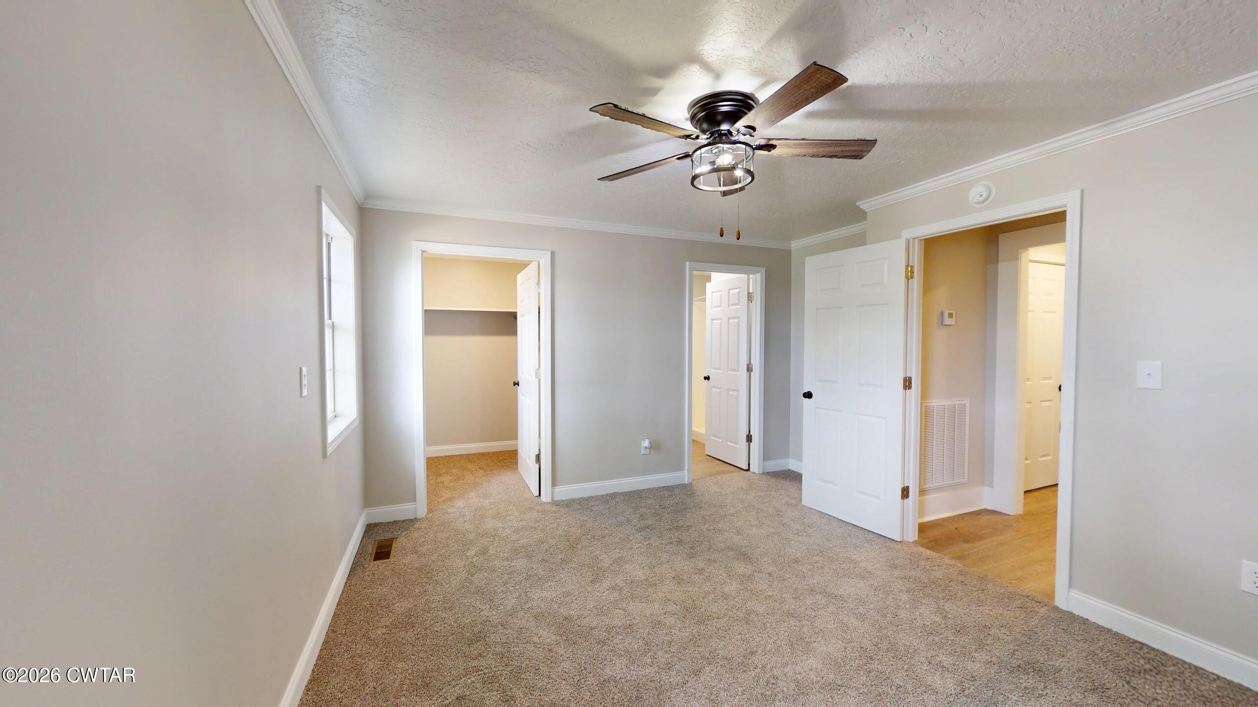 2800 Locust Grove Road Newbern, TN 38059 - Photo 40 of 46 a view of an empty room with a chandelier fan