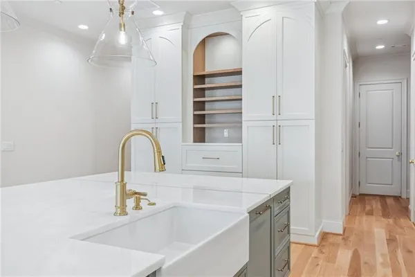 a kitchen with a sink and a refrigerator