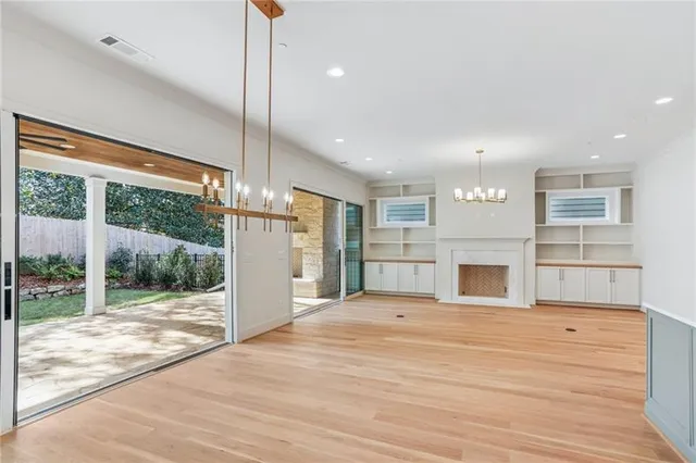 a view of a kitchen with granite countertop cabinets and outdoor space