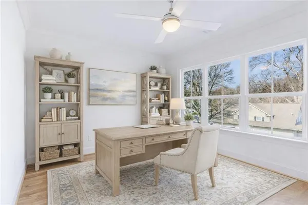 a dining room with a table and chairs