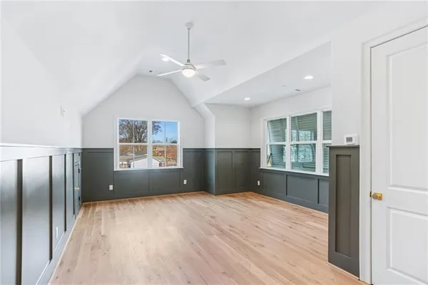 a view of wooden floor and windows in a room