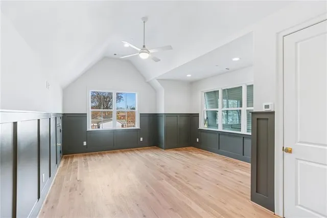 a view of wooden floor and windows in a room
