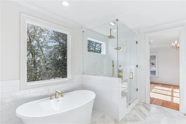 a bathroom with a bathtub and a sink